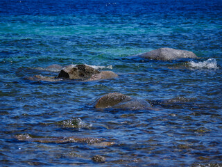 View of Rocks in blue water Lake Tahoe California