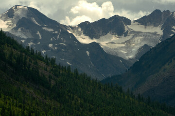 Green slopes of rocky mountains in the Katunsky reserve of Altai