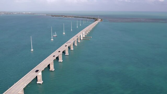 Aerial Time Lapse Shot Of Cars Moving On Famous Bridge, Drone Flying Forward During Sunny Day -  Florida Keys, Florida