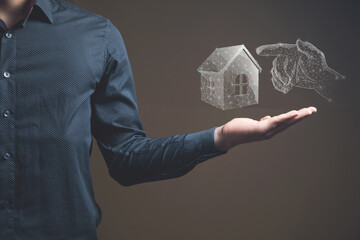 Illustrated house and hand from the net. Man holding in his hands