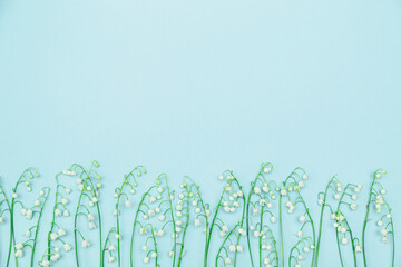 Lilies of the valley on a blue background.