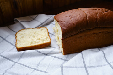 Freshly baked white Japanese milk bread with soft fluffy bun. Homemade pastries for sandwiches