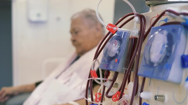 Hardware Hemodialysis. An elderly person, a patient connected to a blood assessment machine.