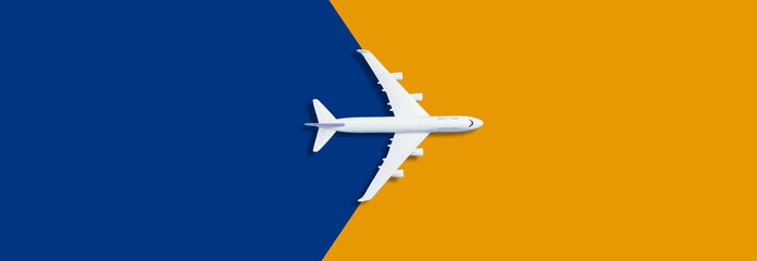 Model plane,airplane on pastel color background orange blue
