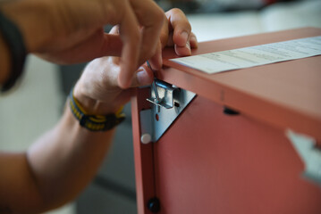 Carpenter working carefully assembling a piece of furniture.