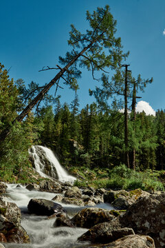 Waterfall of Lake Poperechnoe on the Multa River in the Katunsky Reserve of Altai
