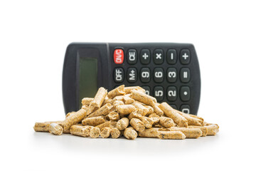 Wooden pellets and calculator isolated on white background. The concept of paying for heating.