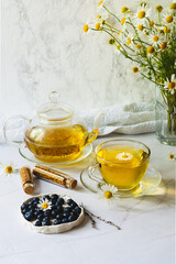 Chamomile tea. Herbal tea in a cup and teapot