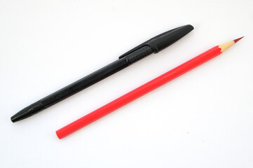 black plastic pen with a cap and a sharp graphite red pencil for drawing on a white background