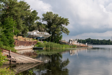 Old hydrofoil ships on the shore and in a flooded form