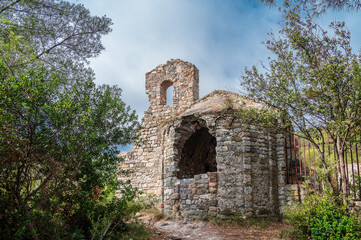 Fototapeta na wymiar Ancient ruined church in Noli