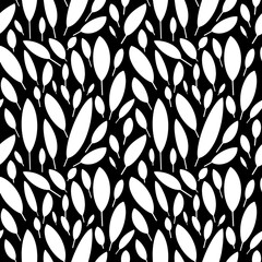 Black and white pattern with leaves.Seamless Botanical pattern in Scandinavian style. White leaves on a black background. Minimalistic and modern design