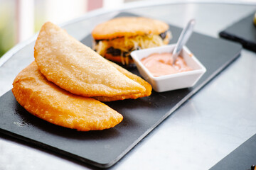 fried empanadas with salsa, traditional Venezuelan food