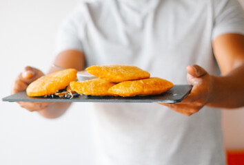 traditional Venezuelan food, fried arepas, empanadas and tequenos