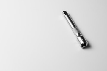 Fototapeta premium The socket wrench lies on a white table