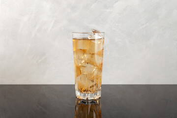 Apple spritzer or Apfelschorle in tall glass. Homemade spritzer served with crushed ice. Sparkling...