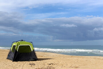 Fototapeta na wymiar Tourist tent on the Mediterranean coast.