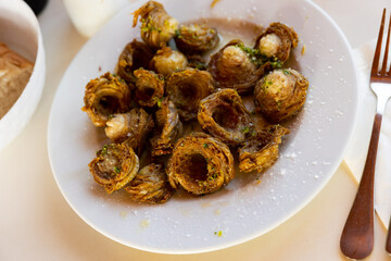 Aragonese Cuisine - fried lamb small iIntestine rings with garlic. Madejas aragones