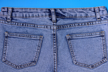 Denim pockets, pockets of denim shorts back view, on a blue background