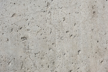 Gray cement wall, with holes and cracks, rough raw surface, construction work, interior design