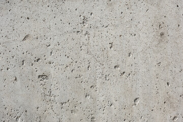 Gray cement wall, with holes and cracks, rough raw surface, construction work, interior design