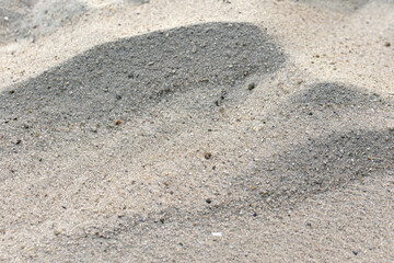 Wavy surface of fine white sand, sandy seashore