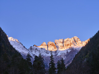 Fototapeta premium mount jiariren-an of the meili snow mountains at sunrise, sichuan, china