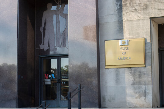 Washington, DC, USA - June 24, 2022: The Voice of American (VOA) sign is seen at the entrance to its headquarters in the Wilbur J. Cohen Building in Washington, DC.