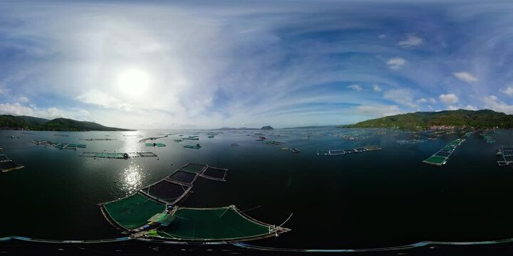 Aerial view of fish farm on Lake Taal near an active volcano. VR 360. Farming aquaculture or pisciculture practices. Philippines, Luzon.