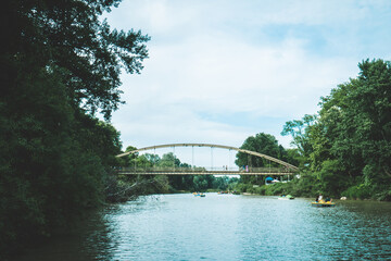 The bridge over the river to the green forest. High quality photo