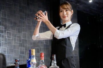 Beautiful bartender with shaker
