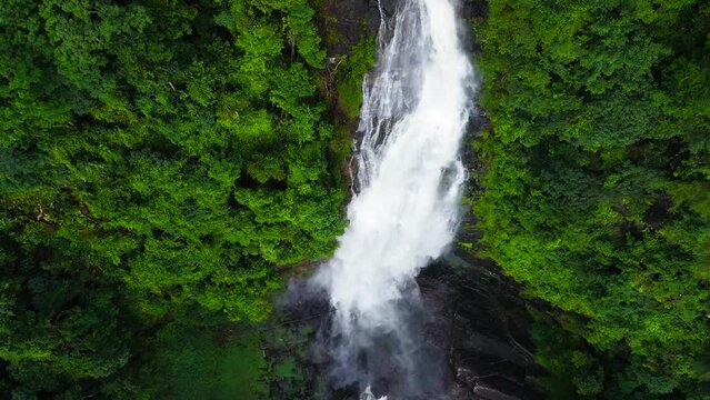 Beautiful waterfall in the rainforest view from above. Mapalana Falls, Sri Lanka.