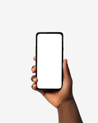 Black hand holding phone facing camera isolated on white background. blank screen, phone screen mockup, front view, clipping path, clipping mask