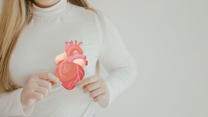 woman holding heart anatomy, heart attack, heart disease, health concept