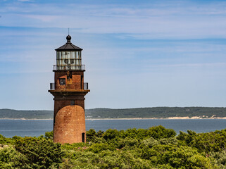 Fototapeta na wymiar Gay Head Lighthouse against blue sky background, Martha's Vineyard