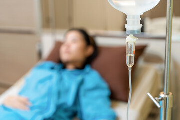 Close up saline solution IV drip fluid intravenous Drop Saline Drip for patient in hospital with...