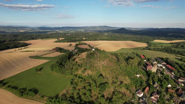 Vysker hill with chapel on the top of the hill,village in Liberec Region,Vyskeř,Czech rpeublic,Europe,aerial panorama landscape view, sunset, scenic panorama