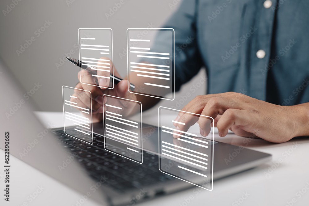 Leinwandbilder a businessman using a laptop computer with electronic document icons, e-document management, an onli