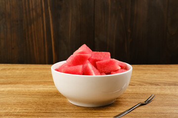 A bowl of fresh watermelon served on white bowl. Breakfast fruit in the morning

