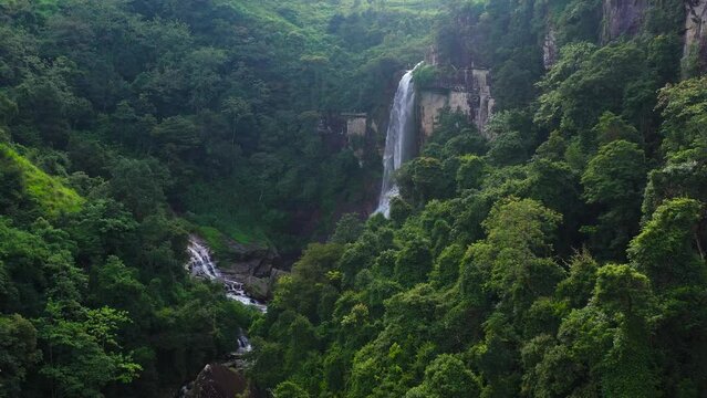 Beautiful waterfall in the rainforest. Ramboda Falls in the tropical mountain jungle. Sri Lanka.