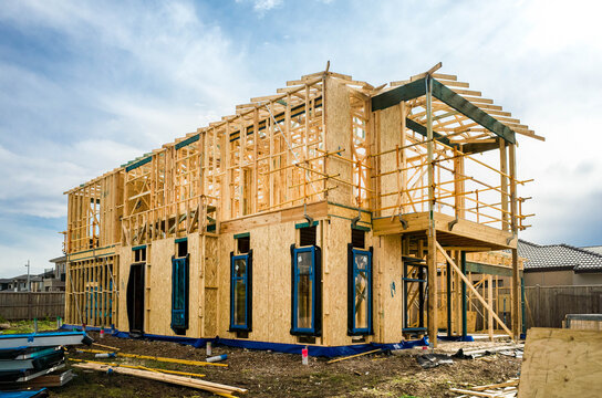 The structure of a two-story residential suburban house under construction. Concept of real estate development, self-build a new home, Australian housing market, and homeownership. Melbourne VIC