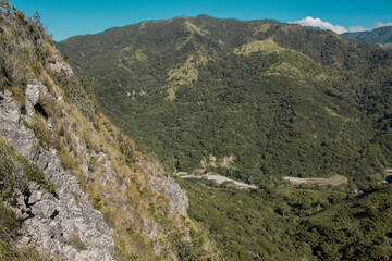 Fototapeta na wymiar rocky ravine in the middle of the green mountains
