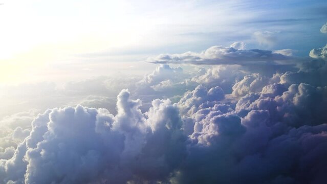 beautiful fluffy clouds in a sky. travelling by air. Airplane flight on sunset