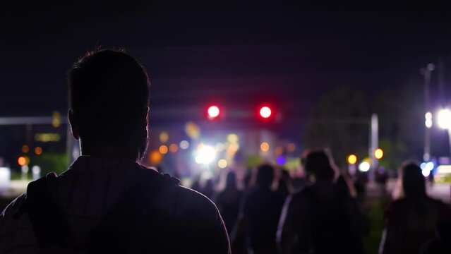 crowded night street. people walking in a night city. youth culture. night event
