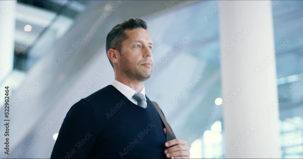 Poster Professional man travelling for a business meeting, checking the time while walking through an airport. Confident, ambitious worker looking relaxed, smiling and satisfied on his way to a conference