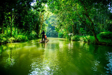 Bamboo rafting in the middle of the natural forest At Mae Pan Village, Phrae Province, Thailand.