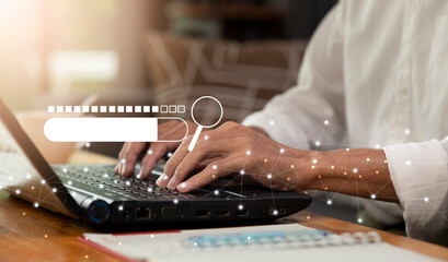 person or student typing on laptop and search data during work and online learning at home