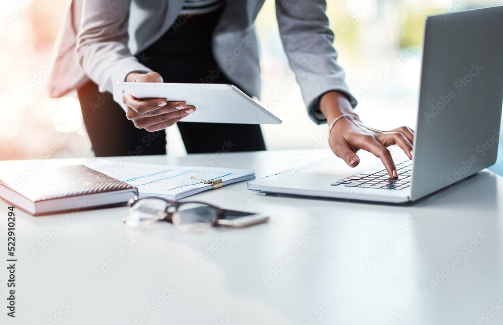 Poster reading, sending or checking an email or report while at work in at a professional desk. hands typin