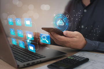 Business Analytics and Data Management System on computer and smartphone,Engineer use smartphone connect data through an online system to search for data in cloud technology laptop calculator on table