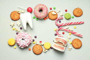 Concept of food bad for teeth on light gray background